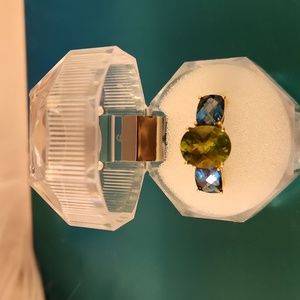 Size 7 10k gold ring with peridot and royal blue topaz. Never worn